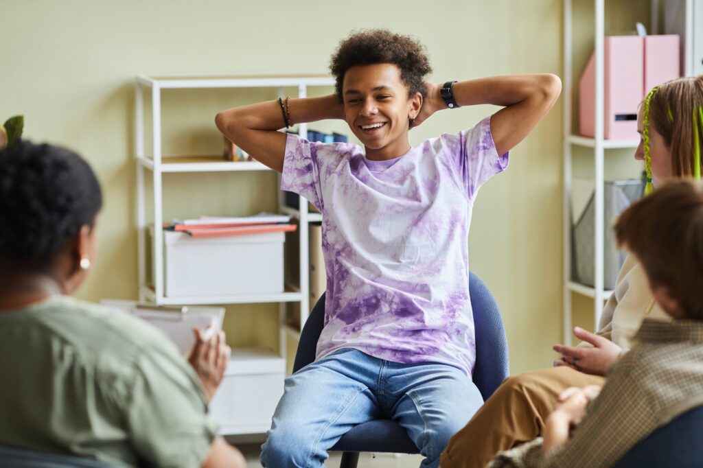 Difficult teenager attending psychotherapy class